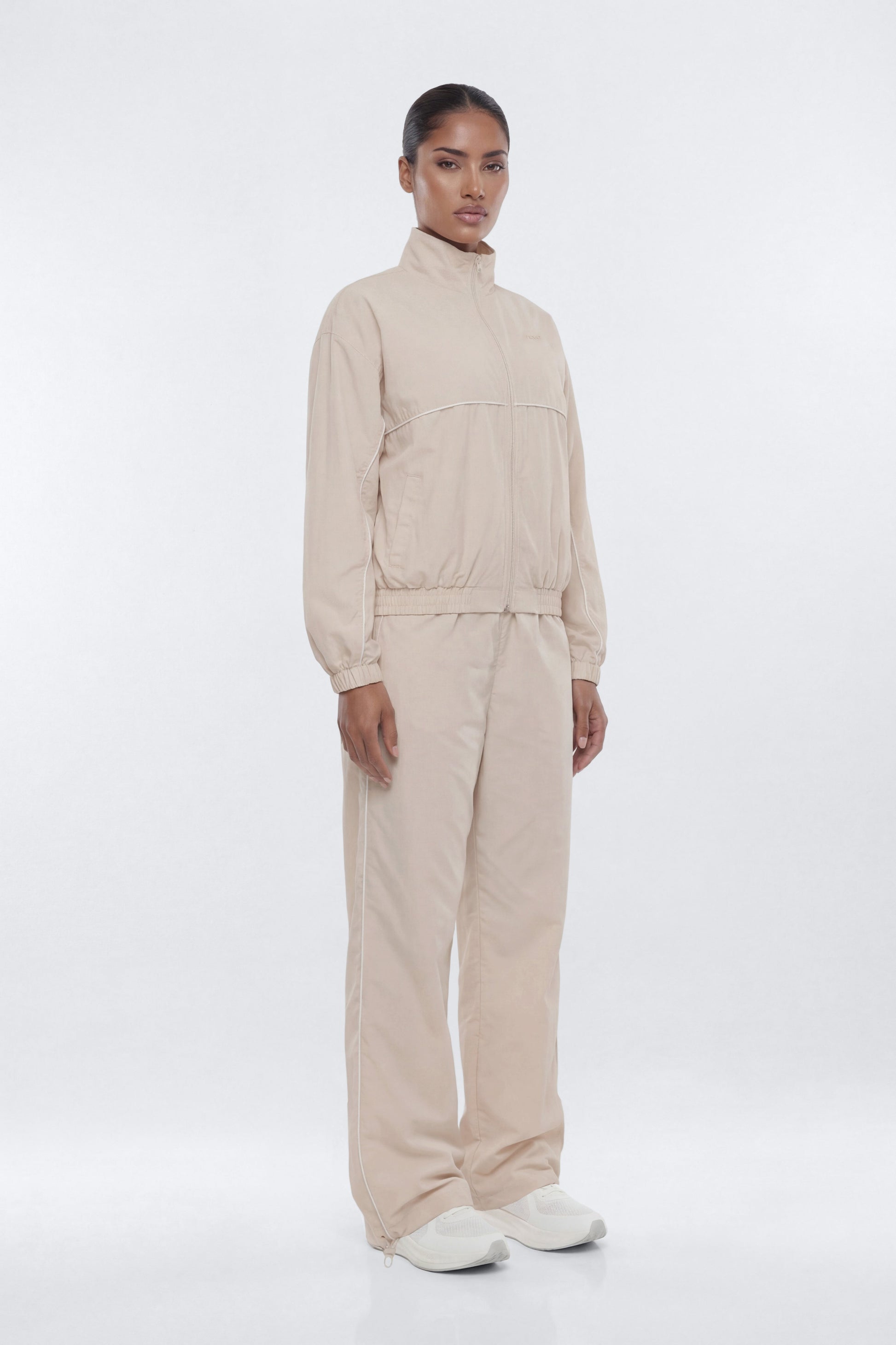 CoreNylon 32″ Pocket Track Pant - Oat Milk Fashion Nova